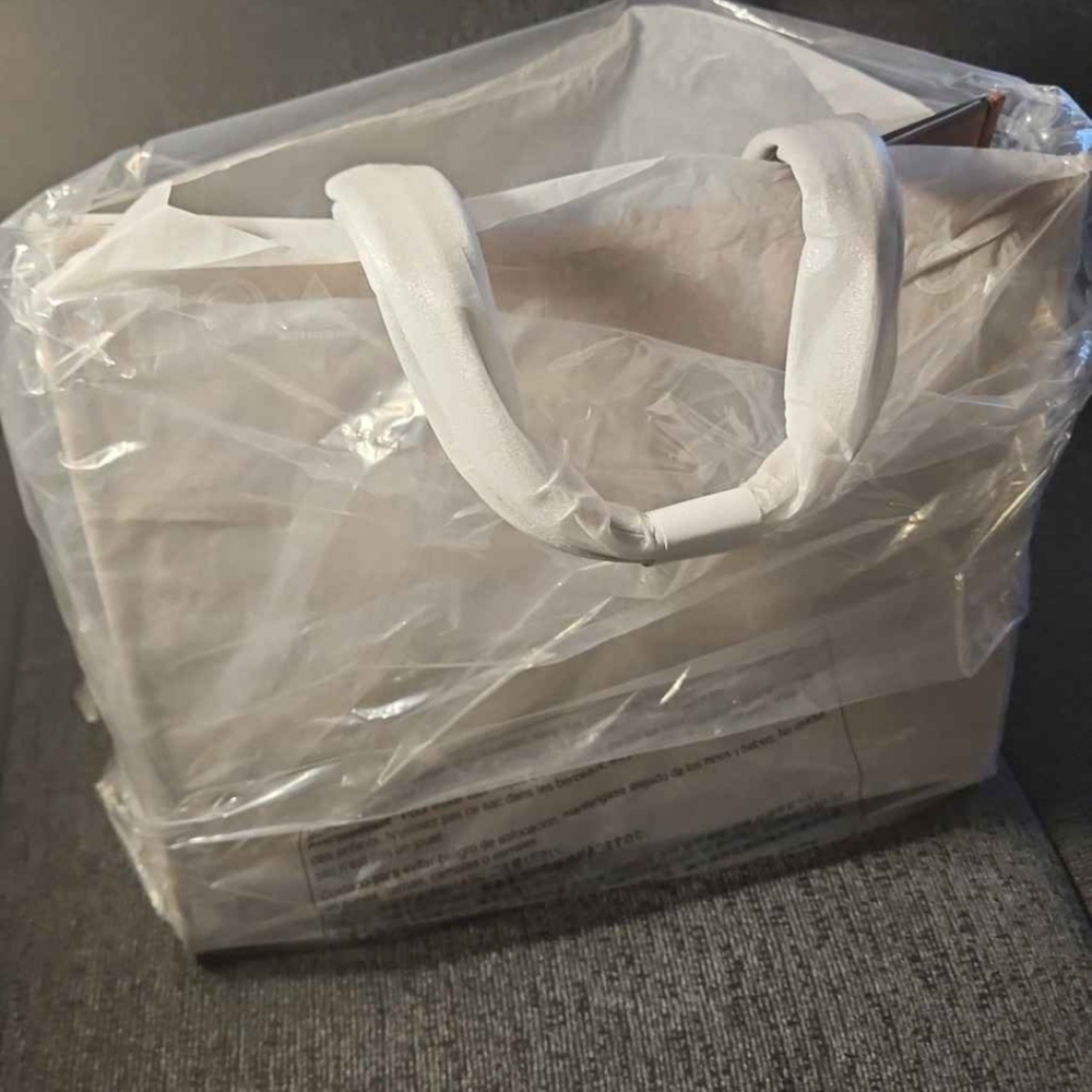 Women's handbag 👜  Cooper logo embossed pebbled leather tote bag .